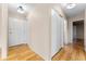 Clean entryway with hardwood floors and mirrored closet doors at 13800 E Marina Dr # 210, Aurora, CO 80014