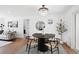 Elegant dining room with modern chandelier, sleek round table and contemporary decor at 290 Beryl Way, Broomfield, CO 80020