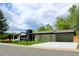 Charming single-story home with modern black trim, carport, fresh grass and new concrete driveway at 290 Beryl Way, Broomfield, CO 80020