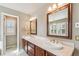 Bathroom features a double vanity, framed mirrors, and decorative lighting at 2250 Indian Paintbrush Cir, Highlands Ranch, CO 80129