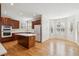 Open kitchen and breakfast area with stainless steel appliances and a kitchen island at 2250 Indian Paintbrush Cir, Highlands Ranch, CO 80129