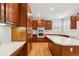 Well-equipped kitchen with a center island, custom cabinets, and modern appliances at 2250 Indian Paintbrush Cir, Highlands Ranch, CO 80129