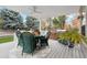 Back patio featuring a glass table, comfortable seating, a grill and a potted plant at 2250 Indian Paintbrush Cir, Highlands Ranch, CO 80129