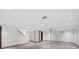 Spacious basement with painted walls, new carpet, and exposed beams at 3384 W Arlington Ave, Littleton, CO 80123