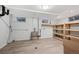 Basement utility space with shelving, a sink, and durable laminate floors at 3384 W Arlington Ave, Littleton, CO 80123