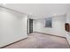 Finished basement with a window and barn door feature; updated and modern at 3384 W Arlington Ave, Littleton, CO 80123
