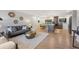 Inviting open-concept living room featuring hardwood floors, modern decor, and abundant natural light at 3384 W Arlington Ave, Littleton, CO 80123