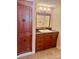 This bathroom has granite countertops and custom cabinets at 7665 E Eastman Ave # 110C, Denver, CO 80231