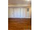 This bedroom has ample closet space and hardwood flooring at 7665 E Eastman Ave # 110C, Denver, CO 80231