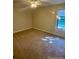 This bedroom features large windows and carpeting at 7665 E Eastman Ave # 110C, Denver, CO 80231
