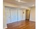 This bedroom has ample closet space and hardwood flooring at 7665 E Eastman Ave # 110C, Denver, CO 80231