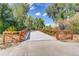 A picturesque bridge amidst lush trees and a clear blue sky, perfect for a scenic walk or bike ride at 7665 E Eastman Ave # 110C, Denver, CO 80231