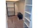 This walk in closet features shelving on all sides at 7665 E Eastman Ave # 110C, Denver, CO 80231