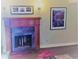 Wooden fireplace with slate surround at 7665 E Eastman Ave # 110C, Denver, CO 80231