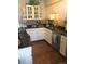 Bright kitchen featuring white cabinets, stainless appliances, and decorative backsplash at 7665 E Eastman Ave # 110C, Denver, CO 80231