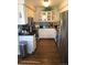 Galley kitchen featuring white cabinets and stainless steel appliances at 7665 E Eastman Ave # 110C, Denver, CO 80231
