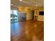 Bright living room with hardwood floors, fireplace, and sliding glass door to the outside at 7665 E Eastman Ave # 110C, Denver, CO 80231