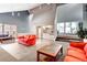 Spacious common room with a functional kitchenette and comfortable seating areas at 7665 E Eastman Ave # 110C, Denver, CO 80231
