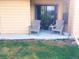 Outdoor patio with two chairs, perfect for relaxing and enjoying the outdoors at 7665 E Eastman Ave # 110C, Denver, CO 80231