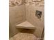 This bathroom features a gorgeous stone shower with a built-in seat at 7665 E Eastman Ave # 110C, Denver, CO 80231