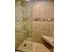 This bathroom features a gorgeous stone shower with a built-in seat at 7665 E Eastman Ave # 110C, Denver, CO 80231
