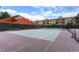 Community tennis court ready for a match, surrounded by residences at 7665 E Eastman Ave # 110C, Denver, CO 80231