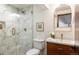 Spa-like bathroom with walk-in shower and marble tile at 3380 S Oak Ct, Denver, CO 80227