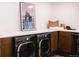 Modern laundry room with LG washer and dryer at 3380 S Oak Ct, Denver, CO 80227