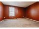 Bedroom with a large window and orange walls at 1811 S Quebec Way # 187, Denver, CO 80231