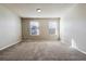 Bright bedroom with neutral paint, carpeted floor and dual windows at 1811 S Quebec Way # 187, Denver, CO 80231