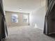 Large bedroom with gray walls and carpet with two large windows at 1811 S Quebec Way # 187, Denver, CO 80231