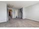 Carpeted bedroom with walk-in closet and access to the bathroom at 1811 S Quebec Way # 187, Denver, CO 80231