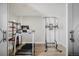 Finished basement gym area with vinyl flooring, exercise machine and free weights at 16383 Ute Peak Way, Broomfield, CO 80023