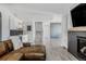 Finished basement with a wet bar, media space and a cozy leather sofa at 16383 Ute Peak Way, Broomfield, CO 80023