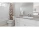 Bathroom featuring a shower over tub, and a vanity with granite counters at 16383 Ute Peak Way, Broomfield, CO 80023