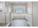 Elegant bathroom with a soaking tub, a walk-in shower, dual vanity sinks, and a serene mountain view at 16383 Ute Peak Way, Broomfield, CO 80023