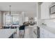 Open-concept layout features a dining area, living room, and seamless transition to the kitchen at 16383 Ute Peak Way, Broomfield, CO 80023