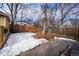 Backyard with patio, fence, and snow on the ground at 3039 W 22Nd Ave, Denver, CO 80211