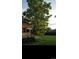 Large backyard with mature tree and green grass at 3039 W 22Nd Ave, Denver, CO 80211