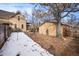 Backyard with detached garage and snow-covered ground at 3039 W 22Nd Ave, Denver, CO 80211