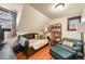 Relaxing bedroom with daybed, armchair, and built-in shelving at 3039 W 22Nd Ave, Denver, CO 80211