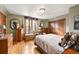 Cozy bedroom with hardwood floors and a large closet at 3039 W 22Nd Ave, Denver, CO 80211