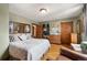 Spacious bedroom with hardwood floors and built-in shelving at 3039 W 22Nd Ave, Denver, CO 80211