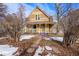 Charming craftsman home with a wrap-around porch and mature landscaping at 3039 W 22Nd Ave, Denver, CO 80211