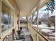 Inviting front porch with ornate railings and comfy seating at 3039 W 22Nd Ave, Denver, CO 80211