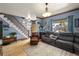 Cozy living room featuring hardwood floors and sectional sofa at 3039 W 22Nd Ave, Denver, CO 80211