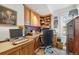 Home office with built-in wood shelving and desk at 3039 W 22Nd Ave, Denver, CO 80211