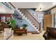 Elegant staircase with wooden railings and hardwood floors at 3039 W 22Nd Ave, Denver, CO 80211