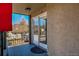 This exterior shot shows the balcony with sliding glass doors to the residence and the surrounding area at 214 N Main St # 14, Breckenridge, CO 80424