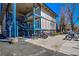 Condominium complex with exterior staircases and covered balconies, featuring bicycle storage at 214 N Main St # 14, Breckenridge, CO 80424